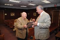 Mr. John Parker is presented with a Resolution appointed him Township Historian for the Township of Lacey .